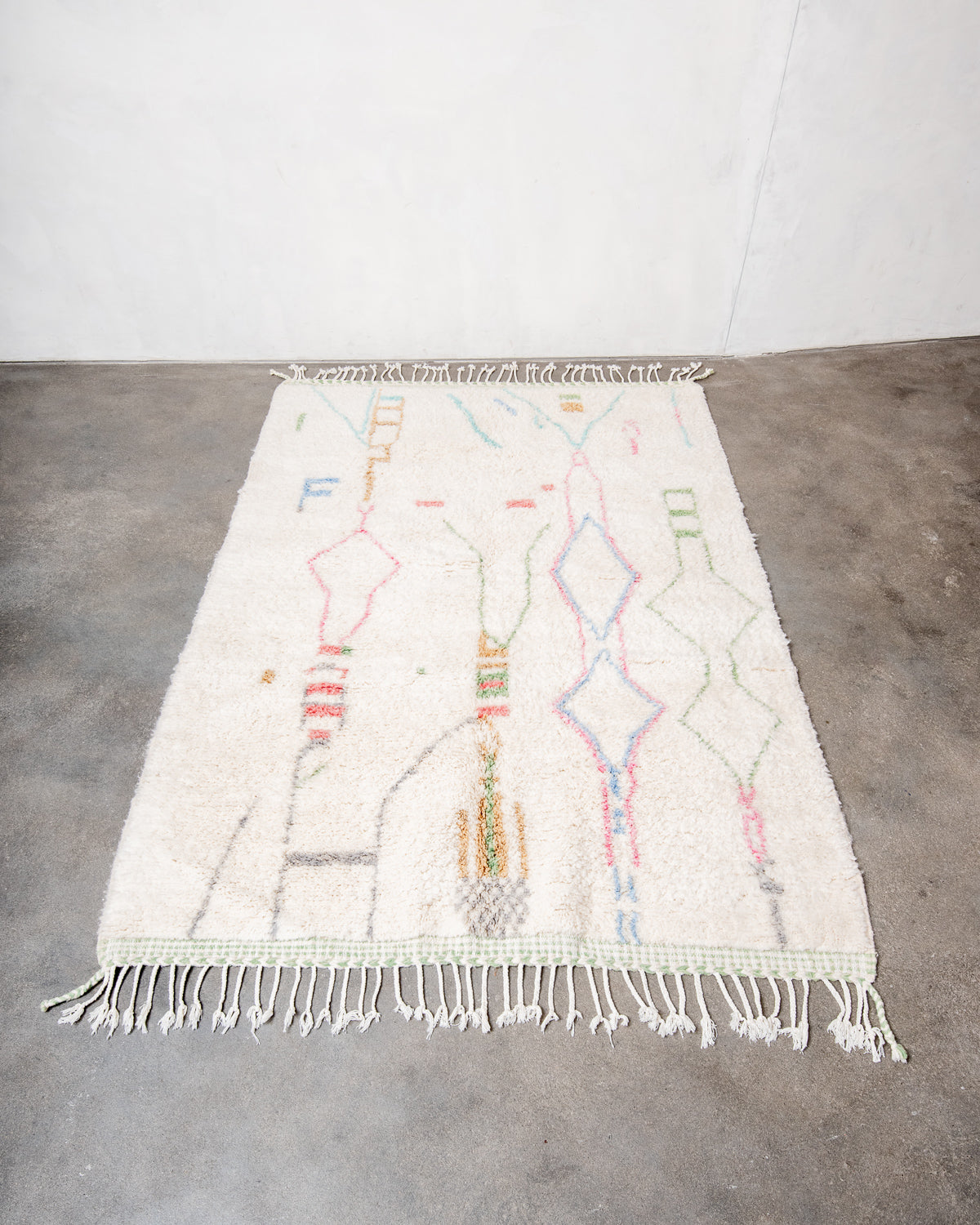 Modern, designer, handcrafted Berber rug from Morocco. Beniourain carpet with minimalist design, natural wool pile and a fluffy texture.